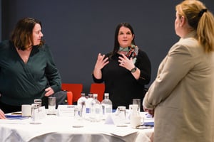 Manager fostering trust in a diverse team, encouraging collaboration and engagement.