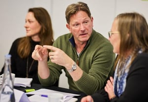 A diverse team collaborating seamlessly in a modern office environment.