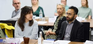 Attendees talking at a Discovery Workshop