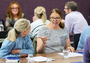 Members of the University of Liverpool Service Delivery Programme Team taking part in a Strengthify discovery workshop, discussing their strengths in small groups.
