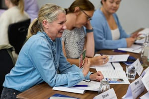 Team members celebrating their strengths and contributions in a supportive environment.