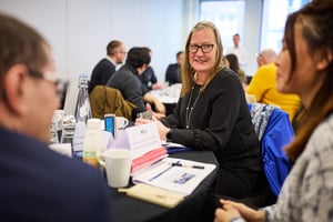Manchester Metropolitan University staff collaborating during a strengths-based team workshop.