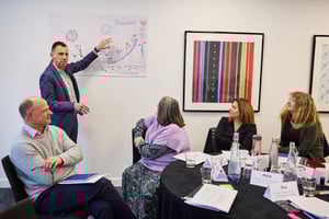 Public sector professionals reconnecting during a facilitated team session focused on healing and trust-building.