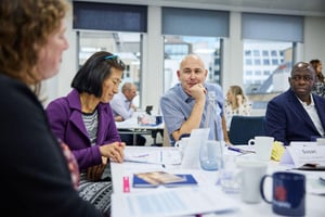 A diverse team collaborating, showcasing innovation, creativity, and problem-solving.